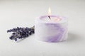 Aromatherapy concept, candle with lavender flowers.Soy candles with lavender scent. Royalty Free Stock Photo