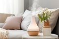 Aromatherapy concept for the home. Aromatic oil diffuser in bedrooms. Air freshener. Ultrasonic aroma diffuser for