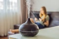 Aromatherapy Concept. Wooden Electric Ultrasonic Essential Oil Aroma Diffuser and Humidifier. Ultrasonic aroma diffuser Royalty Free Stock Photo