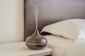 Aromatherapy Concept. Wooden Electric Ultrasonic Essential Oil Aroma Diffuser and Humidifier. Ultrasonic aroma diffuser Royalty Free Stock Photo