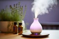 an aromatherapy diffuser emitting a lavender scent in a cozy spa setting Royalty Free Stock Photo