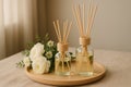 Aromatherapy diffuser set with flowers on wooden tray Royalty Free Stock Photo