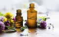 Aromatherapy essential oil bottles, herbal plants and oil
