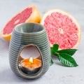 Aromatherapy lamp with grapefruit essential oil, copy space, square