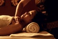 Relaxation Asian woman customer get service aromatherapy massage with masseuse in spa salon