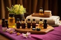 aromatherapy massage setup with oils and towels Royalty Free Stock Photo