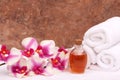 Aromatherapy oils, orchid and towels