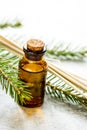 Aromatherapy with organic spruce oils in glass bottles on white