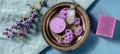 Aromatherapy panorama. Scented candle, soap and perfume vial, shot from the top with vervain and lavender flowers