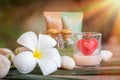 Aromatherapy product spa of therapy massage with plumeria or frangipani flowers, stones, aroma candle and oil on the desk,Spa