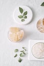 Aromatherapy. Small glass bottles with cosmetic oils. Bath salt. Fresh leaf. Objects for spa procedures on white background oil,