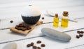 Aromatherapy and spa concept. Spa salt with coffee scent near soap, spa oil and loofah on white background top view