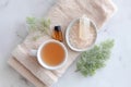 Aromatherapy spa setting with herbal tea, essential oil, and himalayan salt on towel Royalty Free Stock Photo