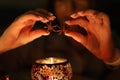 Aromatherapy: two star anise above a warm candle tin creating an aroma evening