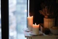 Aromatherapy votive candles burning with a soft glowing flame for a relaxation and pampering wellness treatment session