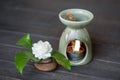 Aromatherpy with jasmine flower perfume on an old wooden background Royalty Free Stock Photo