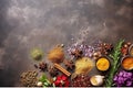 Aromatic assortment, spices and herbs on stone table top view