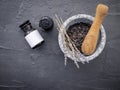 Aromatic  bath salt with lavender flower on dark concrete background. Himalayan salt commonly used in cooking and for bath Royalty Free Stock Photo