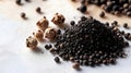 Aromatic black peppercorns and ground spice on white surface, soft lighting, shallow depth of field Royalty Free Stock Photo