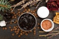 Aromatic botanical cosmetics. Dried herbs flowers mixture, aromatic homemade scrub paste made from coffee grounds and oils. Royalty Free Stock Photo