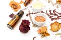 Aromatic botanical cosmetics. Dried herbs flowers mixture, facial mud clay mask, oils, applying brush. Holistic herbal skincare