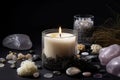 aromatic candle surrounded by crystals, stones and other natural elements