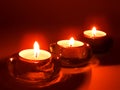 Aromatic candles in glass candlesticks