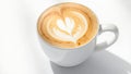 Aromatic cappuccino with a heart in a white mug on a light table. Morning coffee Royalty Free Stock Photo