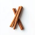 Aromatic cinnamon sticks arranged in a cross pattern on a white background Royalty Free Stock Photo