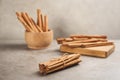 Aromatic cinnamon sticks on grey stone table Royalty Free Stock Photo