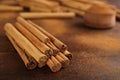 Aromatic cinnamon sticks and powder on wooden table, closeup. Space for text Royalty Free Stock Photo