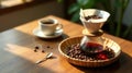 Aromatic coffee brewing process sunlit tabletop with pour over coffee maker, freshly roasted beans, and a cup of dark brew. Royalty Free Stock Photo