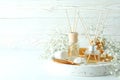Aromatic concept with diffusers on white wooden table