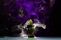Aromatic cone smoldering in a ceramic stand Royalty Free Stock Photo