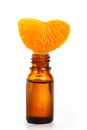 Aromatic essence oil and fresh orange segment Royalty Free Stock Photo