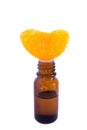 Aromatic essence oil and fresh orange segment Royalty Free Stock Photo