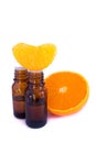 Aromatic essence oil and fresh orange segment Royalty Free Stock Photo