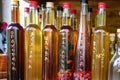 Aromatic home made and very healthy brandy Serbian Rakija with different herbs inside the bottle Royalty Free Stock Photo