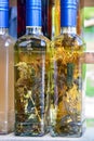 Aromatic home made and very healthy brandy Serbian Rakija with different herbs inside the bottle, perfect decorative gift