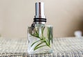 Aromatic home spray air freshener in a transparent glass bottle