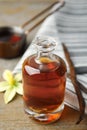 Aromatic homemade vanilla extract on table, closeup Royalty Free Stock Photo