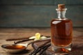 Aromatic homemade vanilla extract on table, closeup. Space for text Royalty Free Stock Photo