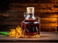 Aromatic homemade vanilla extract on wooden table, closeup. Space for text. Royalty Free Stock Photo