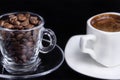 Aromatic morning coffee in a white cup, coffee grains