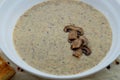 Aromatic mushroom cream soup with champignons. Fresh vegetables and freshly baked bread. A hearty and delicious lunch. Royalty Free Stock Photo