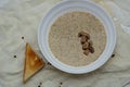 Aromatic mushroom cream soup with champignons. Fresh vegetables and freshly baked bread. A hearty and delicious lunch. Royalty Free Stock Photo