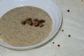 Aromatic mushroom cream soup with champignons. Fresh vegetables and freshly baked bread. A hearty and delicious lunch. Royalty Free Stock Photo