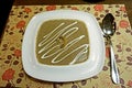 Aromatic mushroom soup made of champignons in a white porcelain dish.