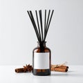 Aromatic Oil Diffuser with Cinnamon Sticks and Anise Star on White Surface Royalty Free Stock Photo