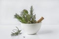 Aromatic plant: lavender, rosemary, thyme in the white ceramic mortar with pestle Royalty Free Stock Photo